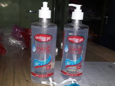Hand sanitizer bottles laid out for distribution at the school.