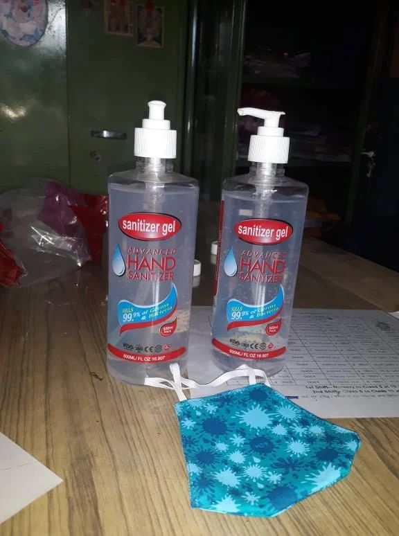 Hand sanitizer bottles laid out for distribution at the school.